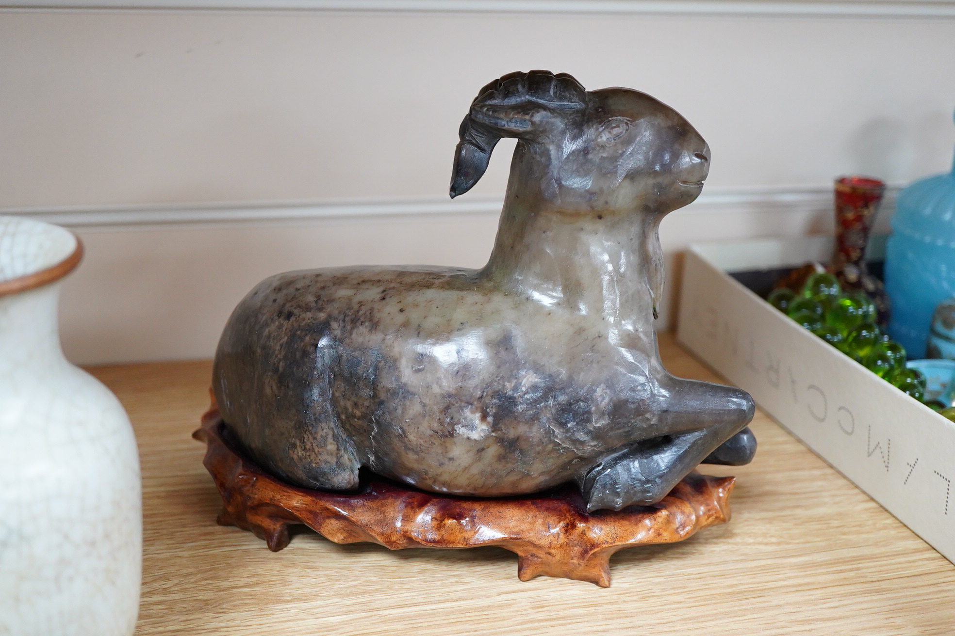 A group of Chinese collectables to include a soapstone carving of a ram, crackle glaze vase and figures of elders, largest 23cm wide